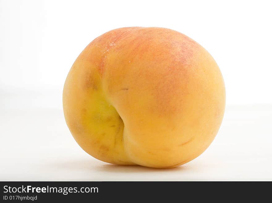 Fresh peaches isolated on a white background