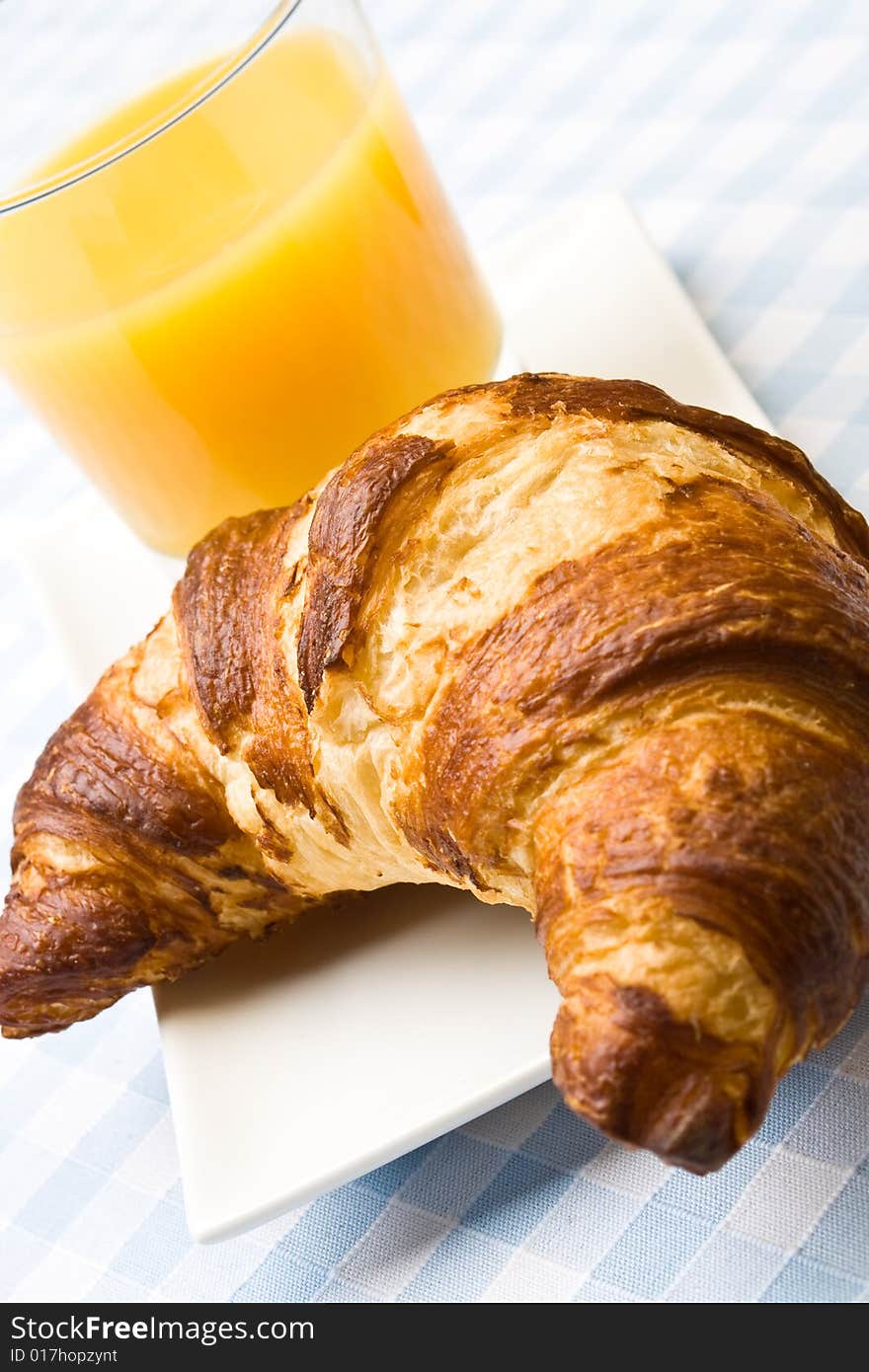 Fresh croissant with orange juice