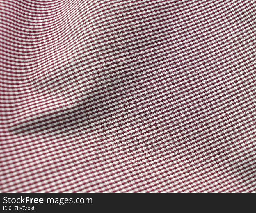 Close up of pleated checkered fabric cloth. Close up of pleated checkered fabric cloth.