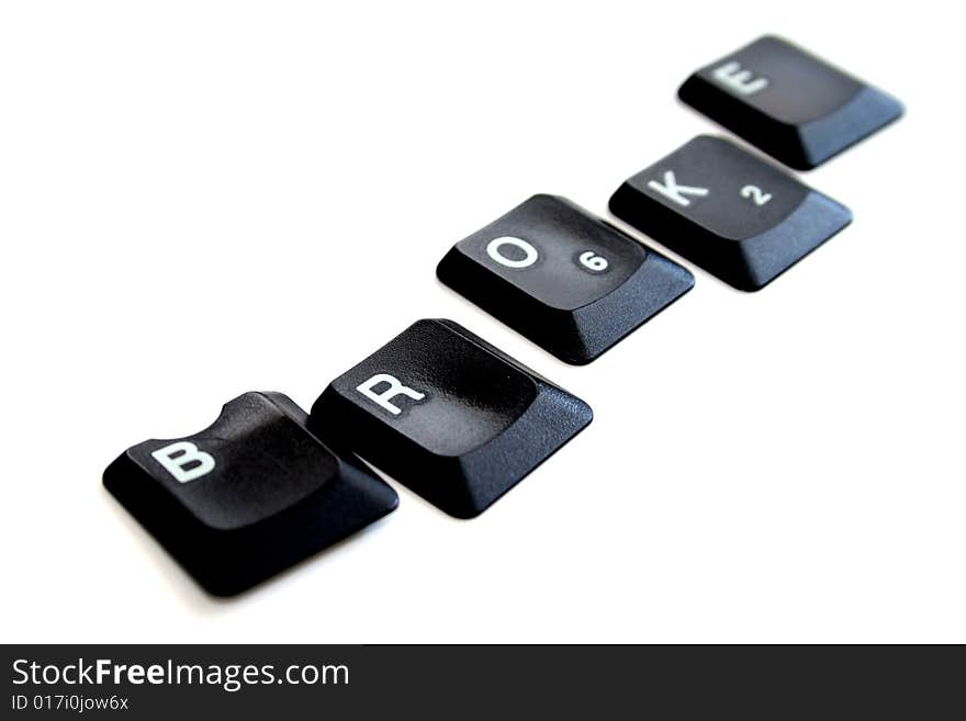 The word broke spelled out in keys from a computer keyboard