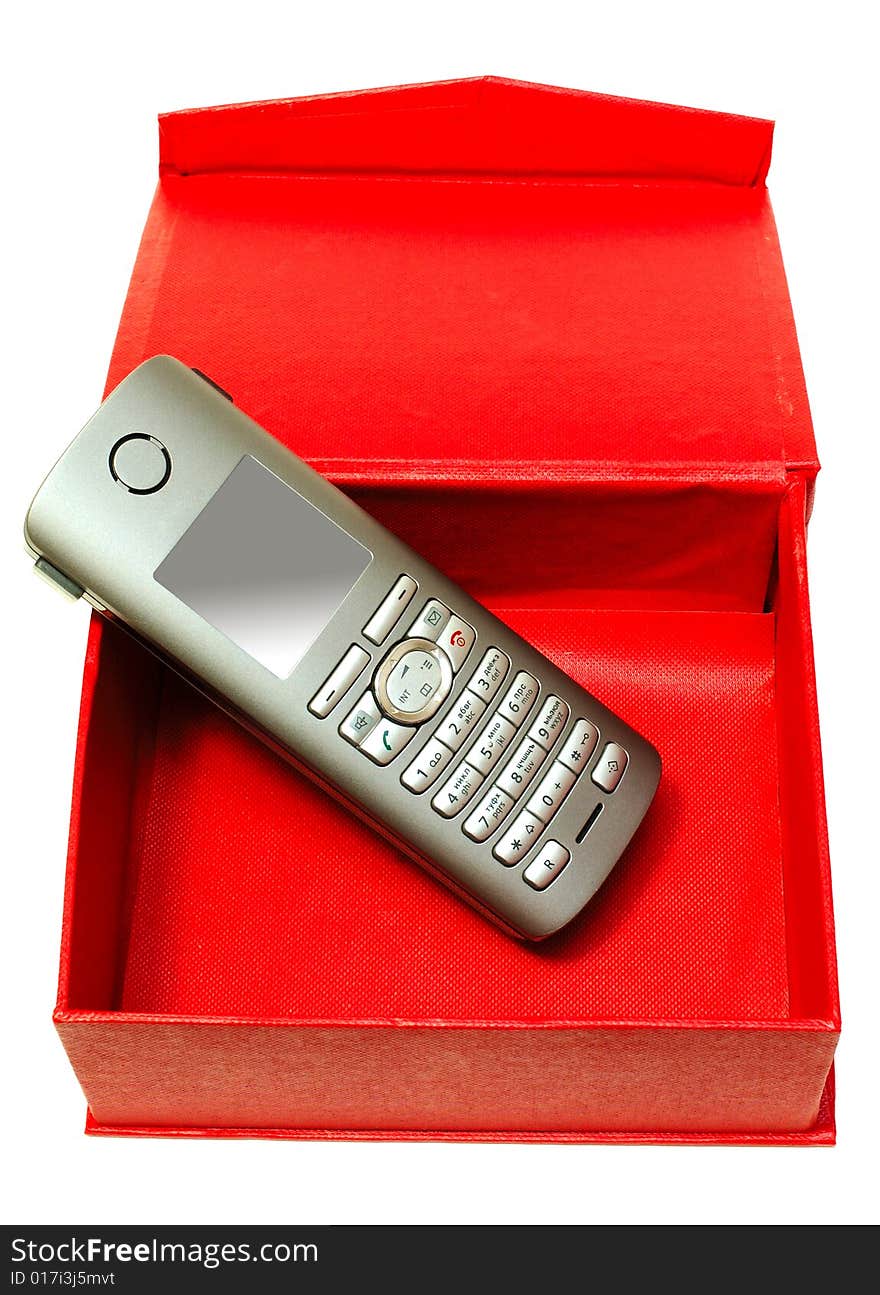 Gray (silver) mobile (radio) telephone and red cardboard box on isolated background. Gray (silver) mobile (radio) telephone and red cardboard box on isolated background.