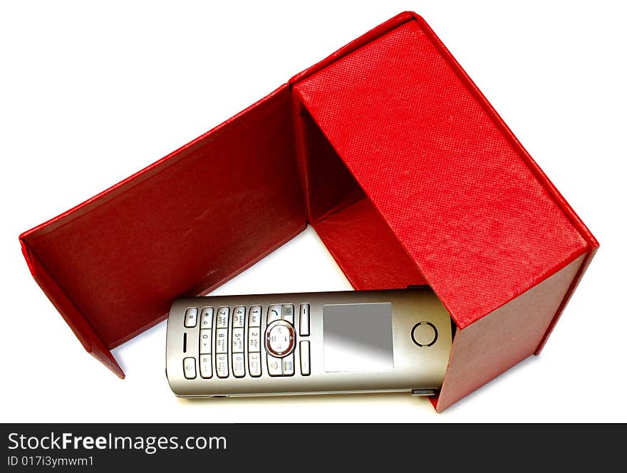 Gray (silver) mobile (radio) telephone and red cardboard box on isolated background. Gray (silver) mobile (radio) telephone and red cardboard box on isolated background.