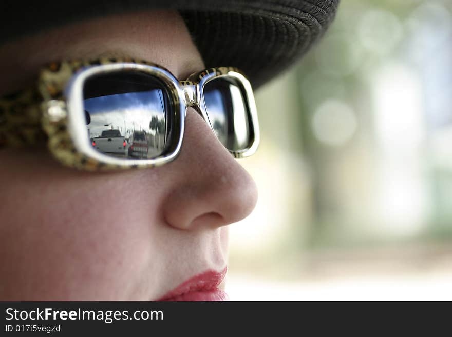 Woman's face closeup with reflection of traffic. Woman's face closeup with reflection of traffic