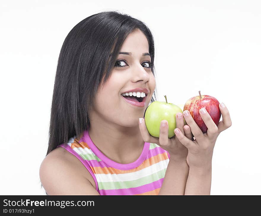 Asian woman with one green and one red apple. Asian woman with one green and one red apple