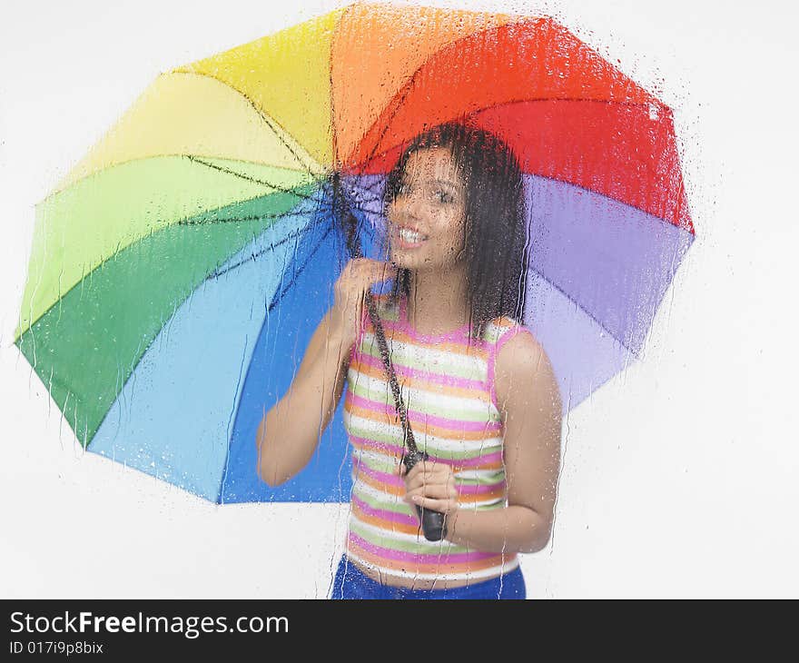 Asian girl with a colourful umbrella. Asian girl with a colourful umbrella