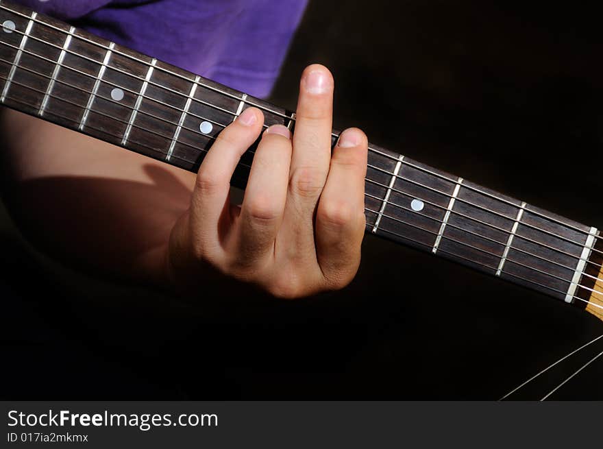 Detail of male hands playing electric guitar. Detail of male hands playing electric guitar