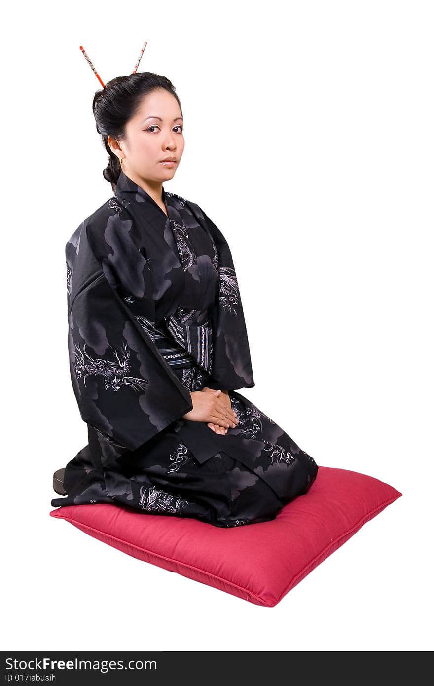 The asian woman kneeling down the pillow. The asian woman kneeling down the pillow