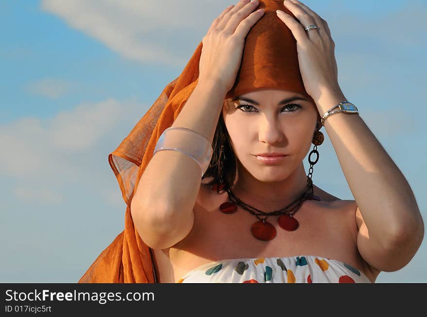 Portrait of young trendy female model posing outdoors. Portrait of young trendy female model posing outdoors