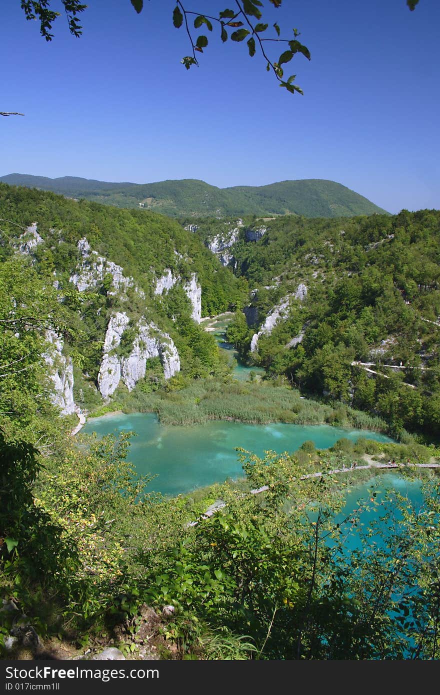 Green lake with footpath in Plitvice