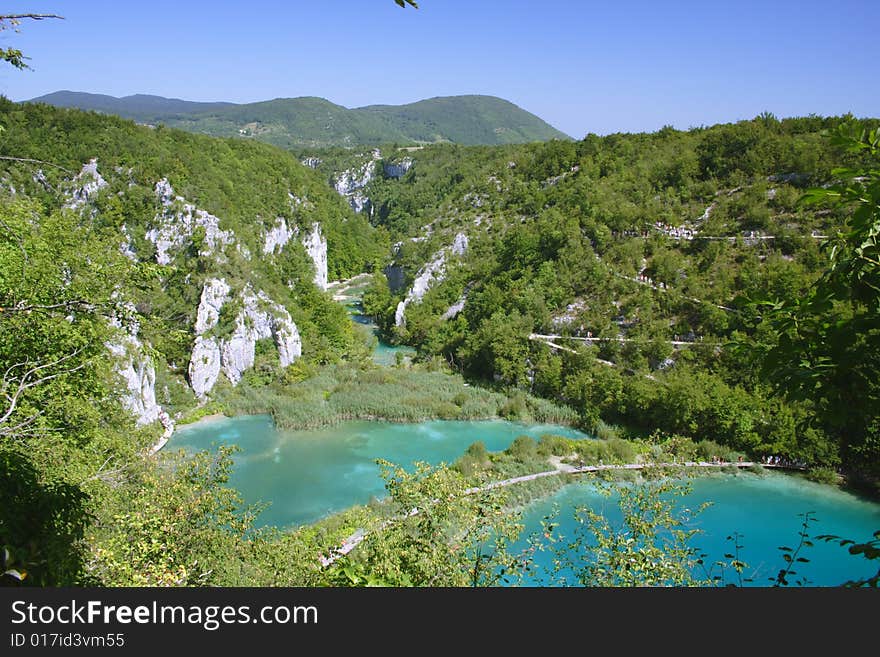 Green lake with footpath in Plitvice