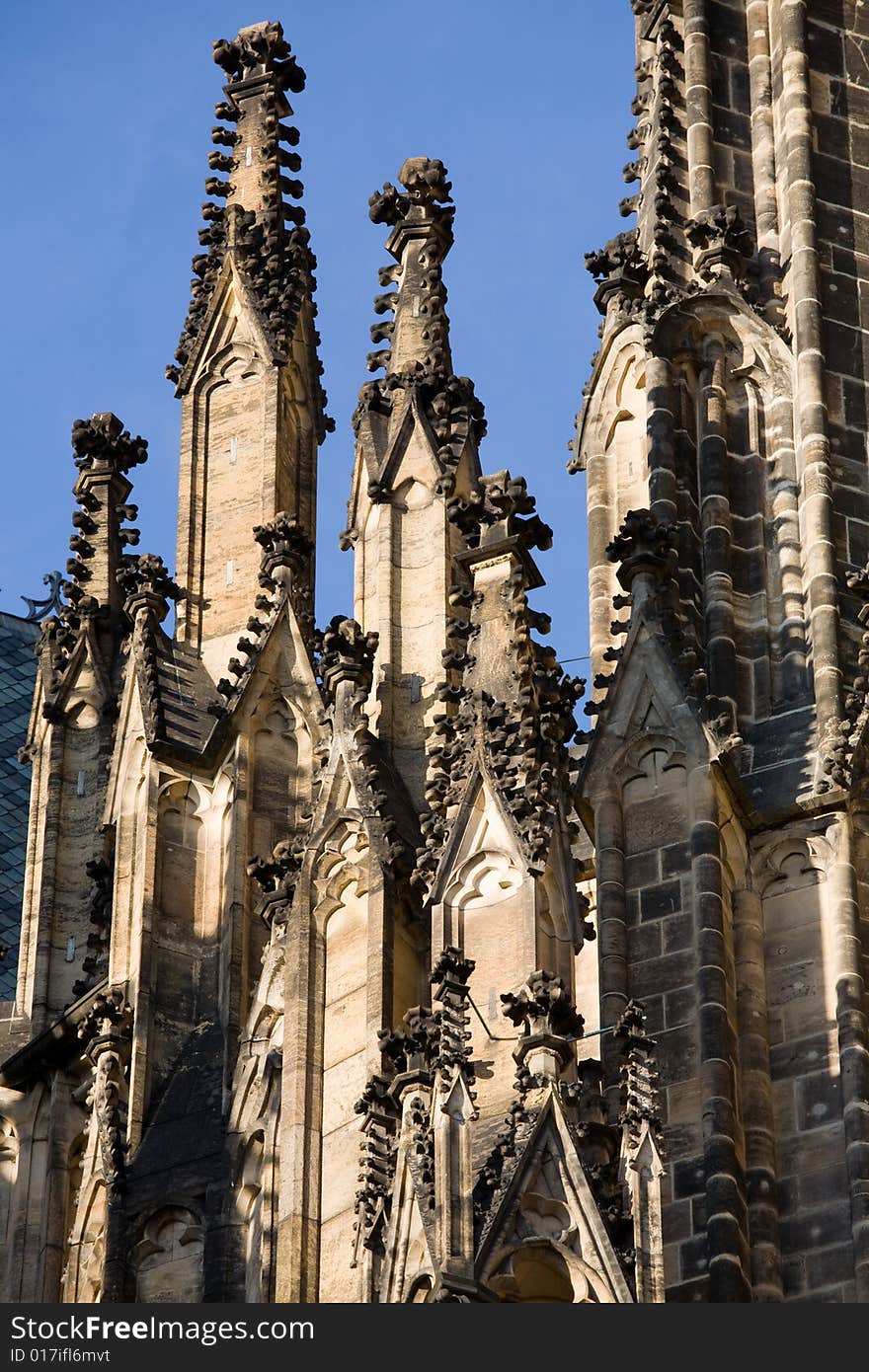 Detail of gothic towers of the famous cathedral St. Vitus in Prague. Detail of gothic towers of the famous cathedral St. Vitus in Prague.