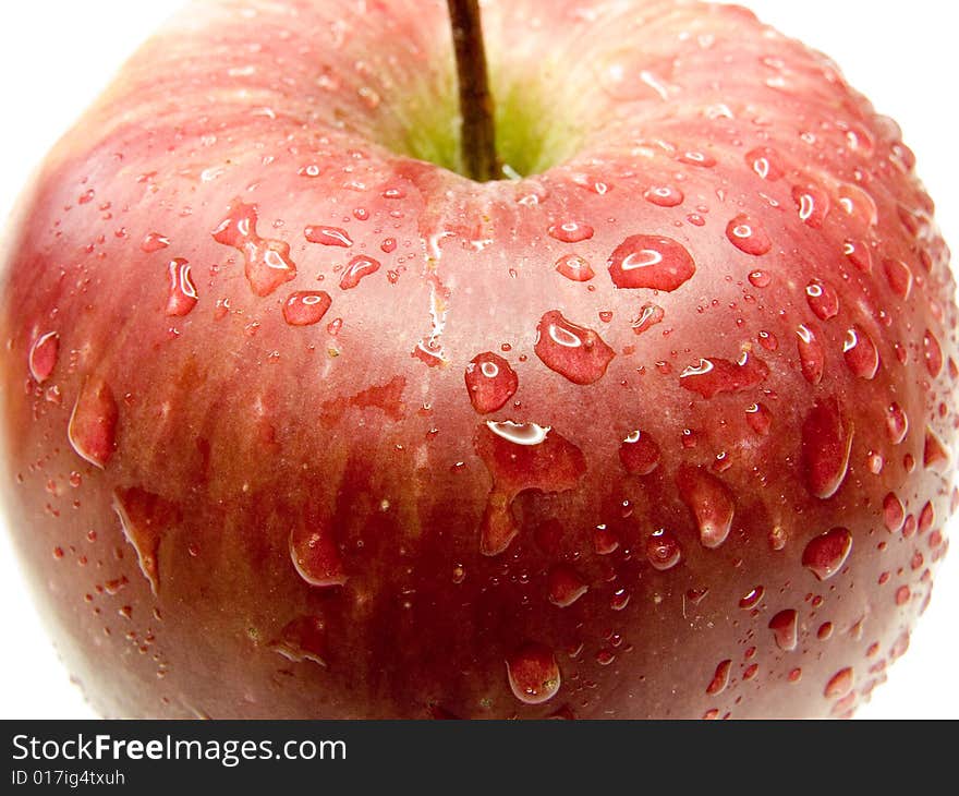 Red apple with water drops isolated on a white background