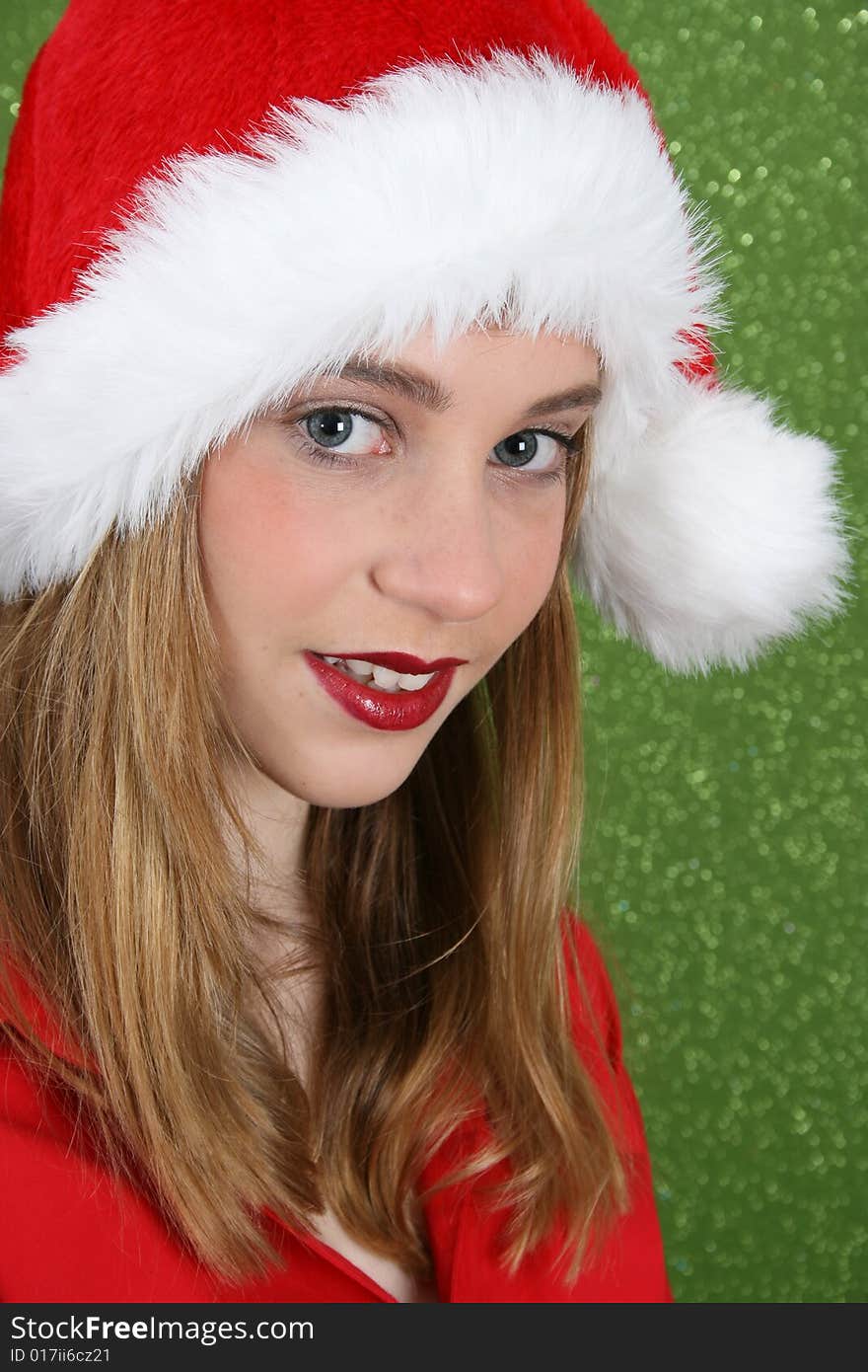 Teenager with red lips wearing a christmas hat. Teenager with red lips wearing a christmas hat