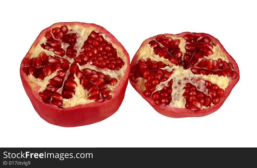 The red cut pomegranate on a white background