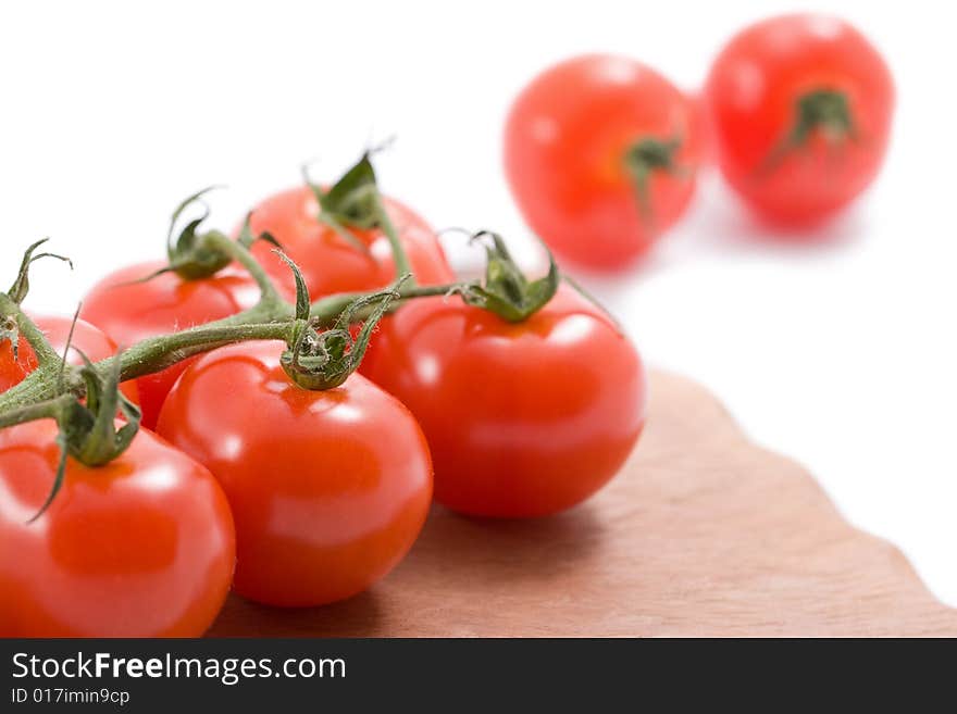 Ripe Tomatoes Over Wood Board Isolated