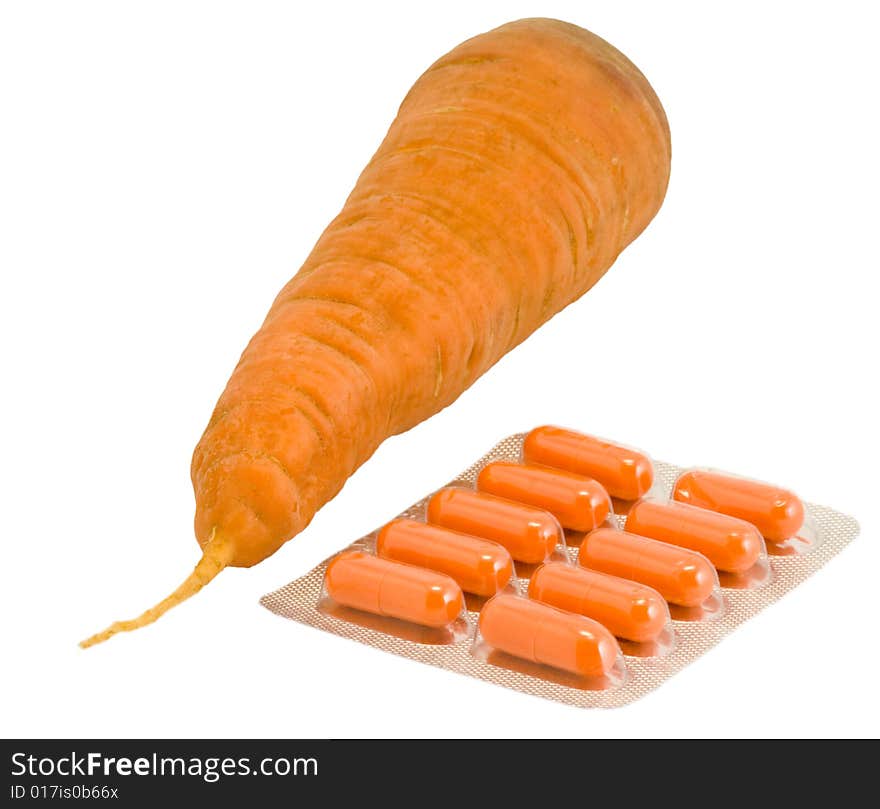 Vitamin pills with carrot on isolated white. Make your choice. Vitamin pills with carrot on isolated white. Make your choice