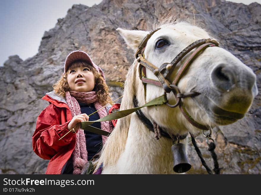 The girl riding a horse