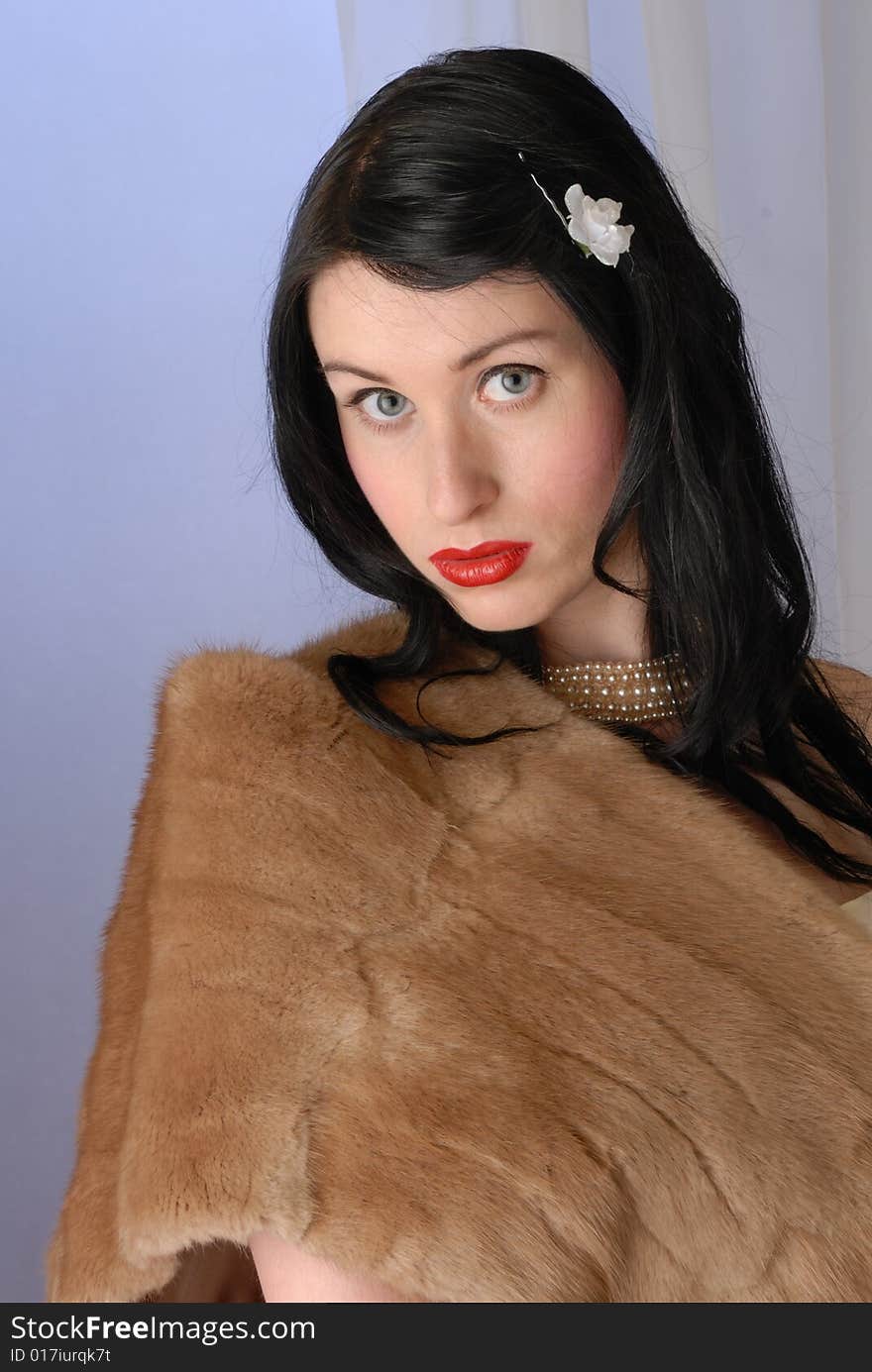 Fifties pinup girl in fur wrap