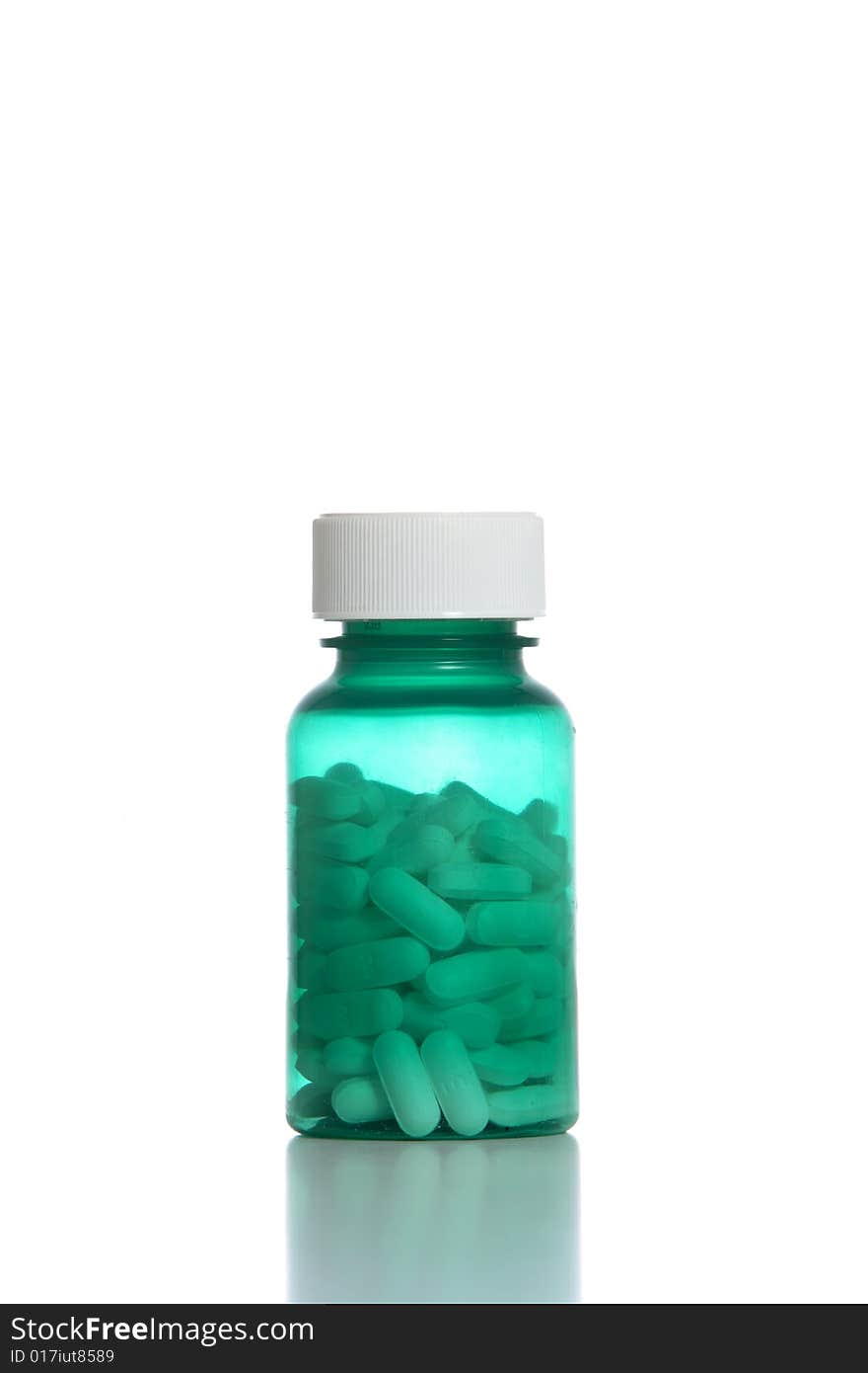 A bottle filled with pills in the studio