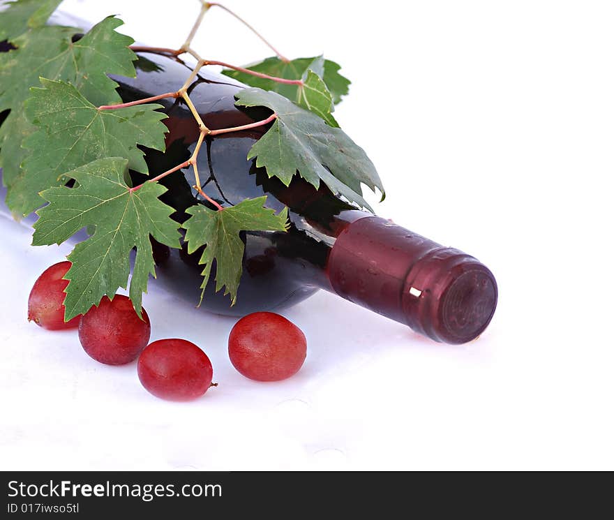 Wine bottle and grapes