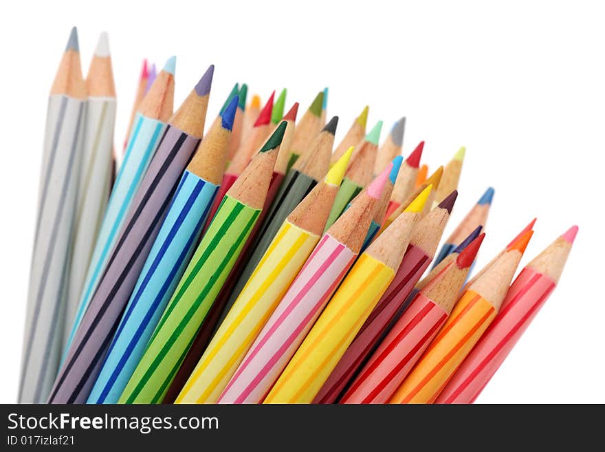 Close up of color pencils with different color over white background.