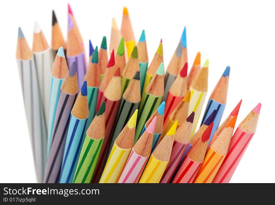 Close up of color pencils with different color over white background.