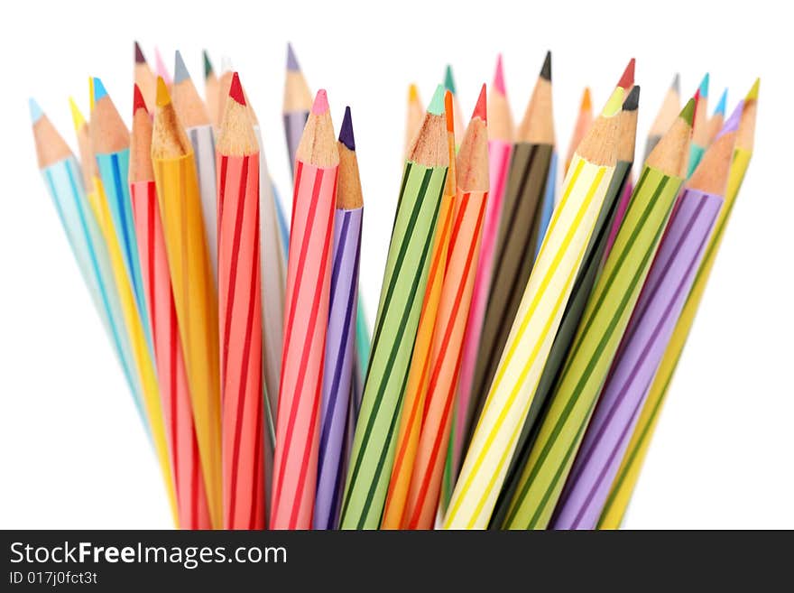 Close up of colorful color pencils over white background.