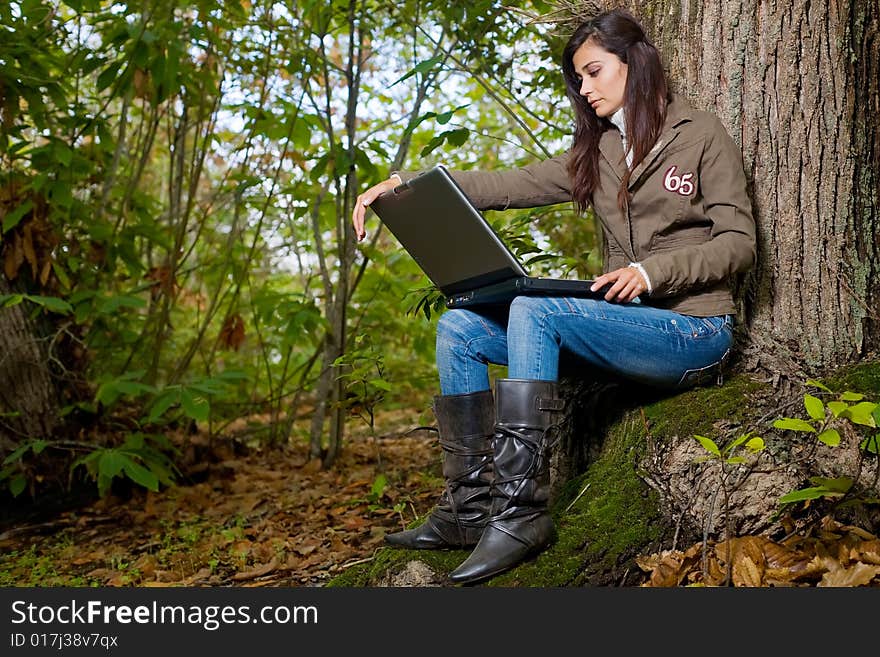 Young woman on autumn forest under chestnut tree. Young woman on autumn forest under chestnut tree