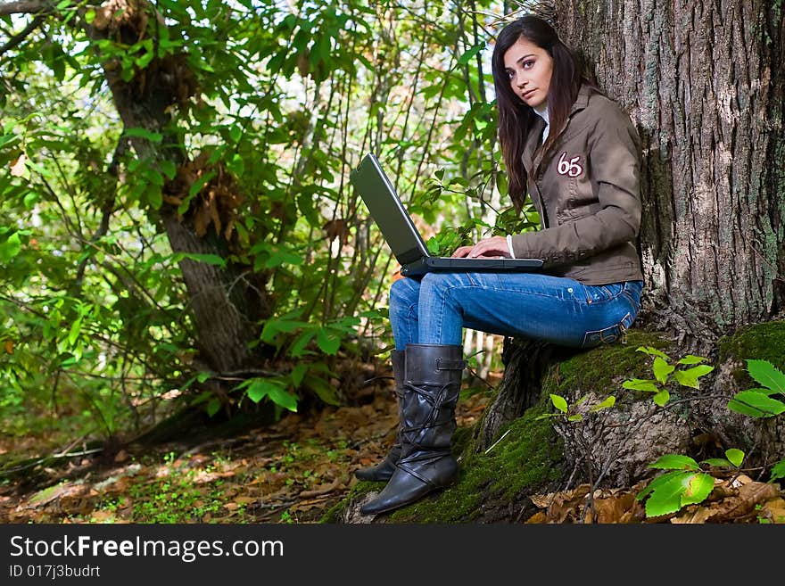 Young woman on autumn forest under chestnut tree. Young woman on autumn forest under chestnut tree