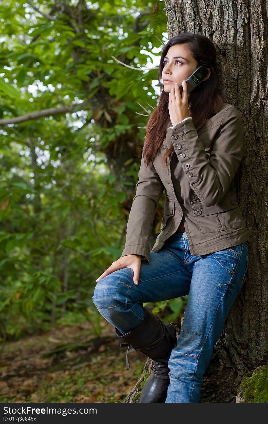 Young woman on autumn forest under chestnut tree. Young woman on autumn forest under chestnut tree