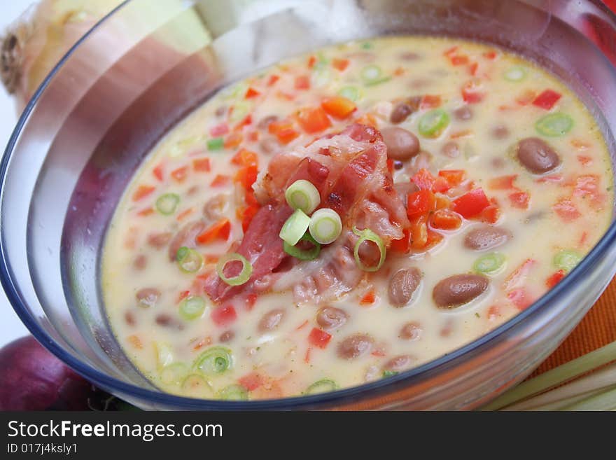 A fresh soup of beans and paprika with some onions