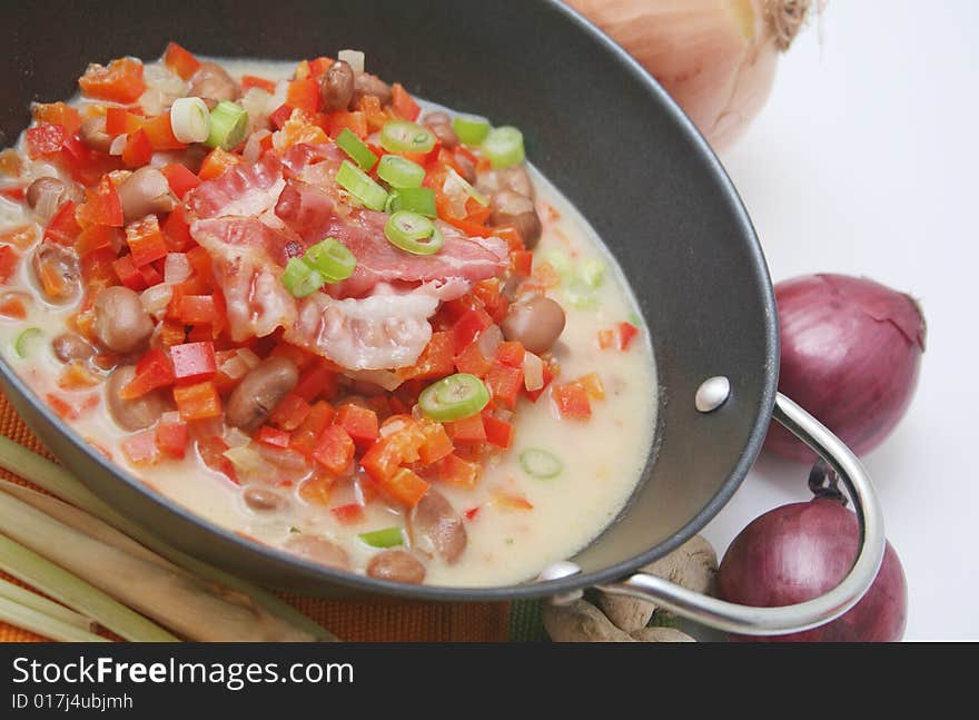 A fresh soup of beans and paprika with some onions