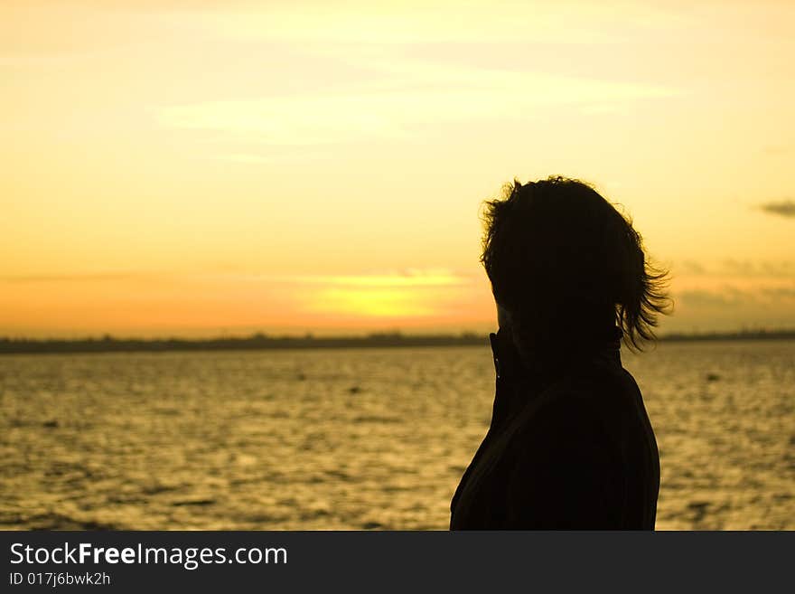 A woman looking at the sunset