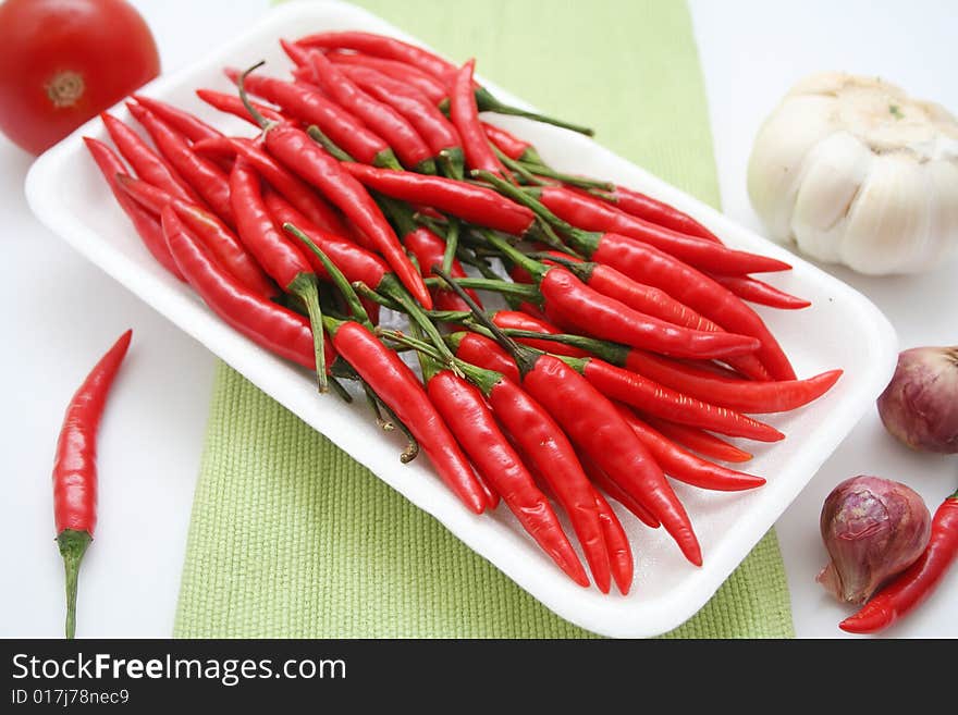 Some fresh asian chili´s in a cardboard. Some fresh asian chili´s in a cardboard