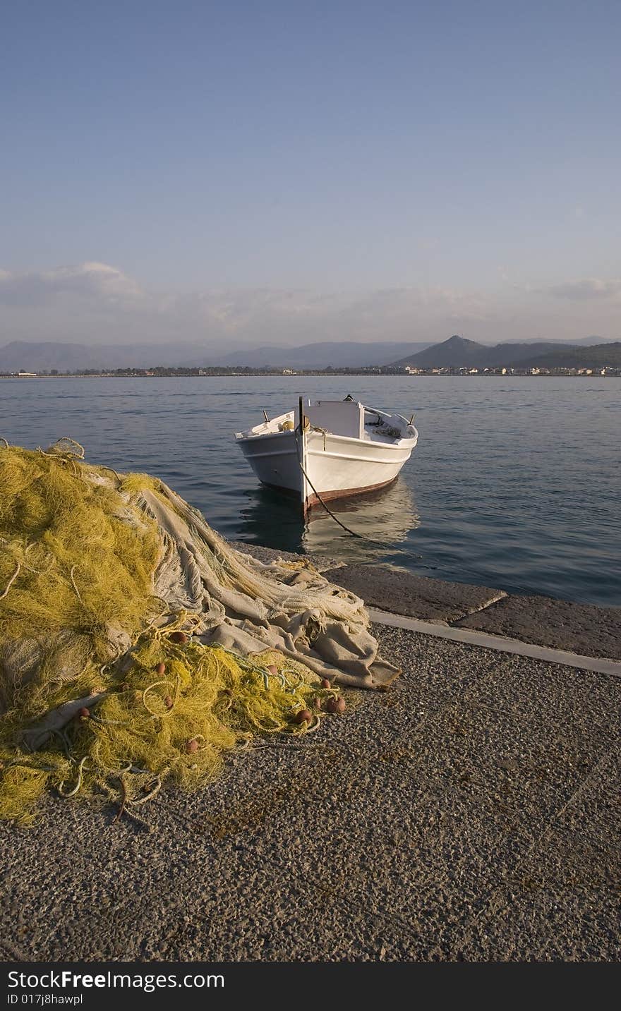 Fishing boat and fishing net in the harbor