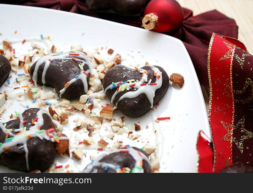 Some christmas cockie on a plate with white chocolate. Some christmas cockie on a plate with white chocolate