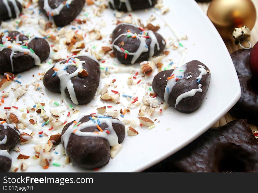 Some christmas cockie on a plate with white chocolate. Some christmas cockie on a plate with white chocolate