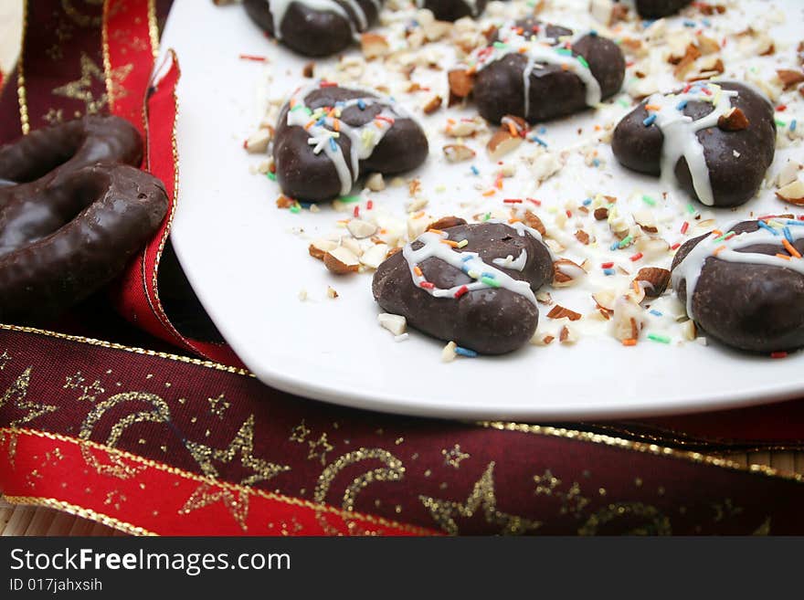 Some christmas cockie on a plate with white chocolate. Some christmas cockie on a plate with white chocolate