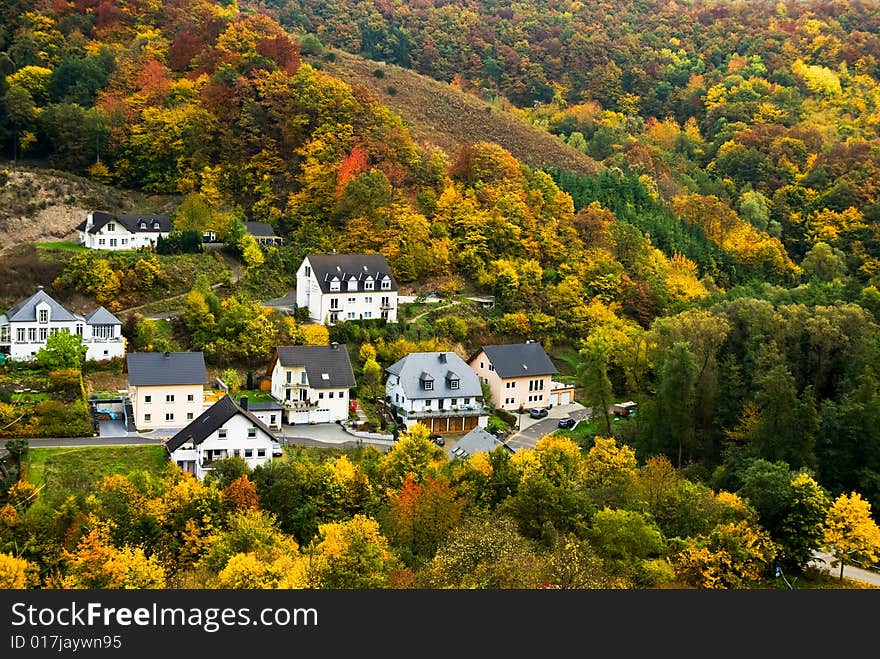 Colorful autumn forest  and village along the mosel river in germany