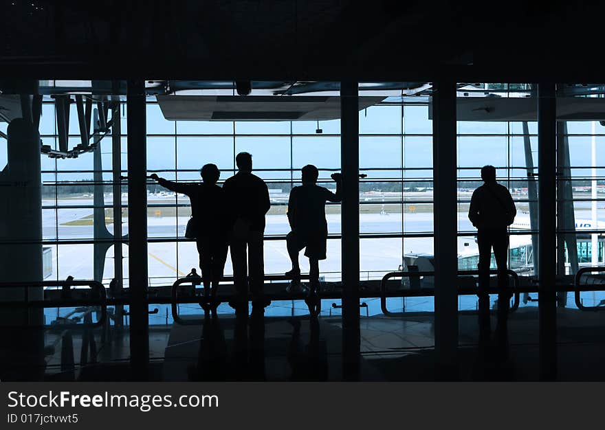 People waiting in the airport. People waiting in the airport