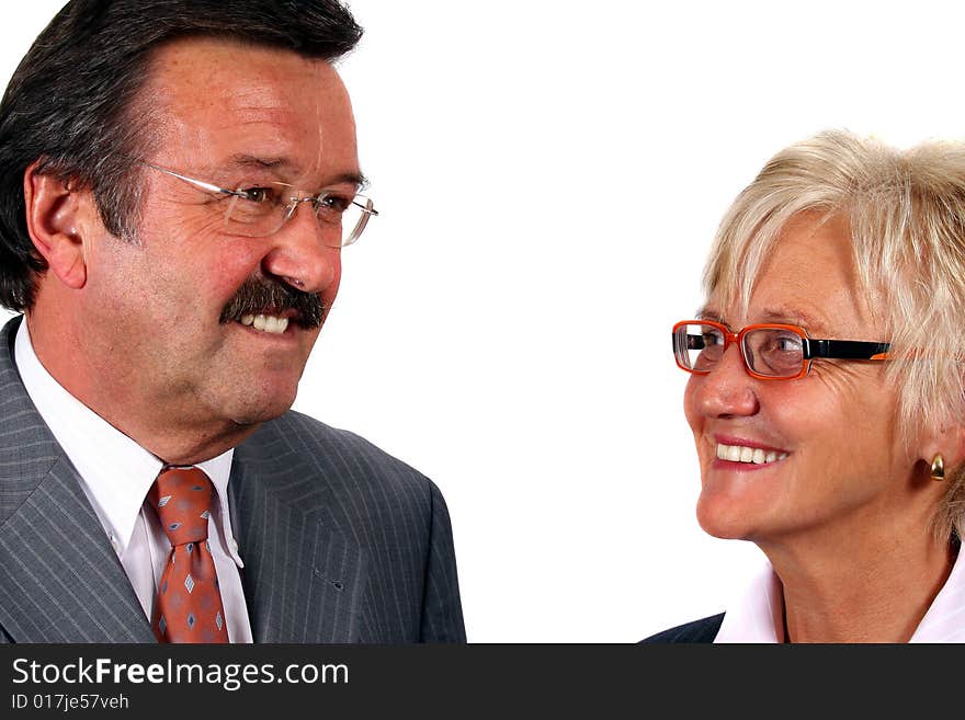 A business woman and a man looking at each other. Isolated over white. A business woman and a man looking at each other. Isolated over white.