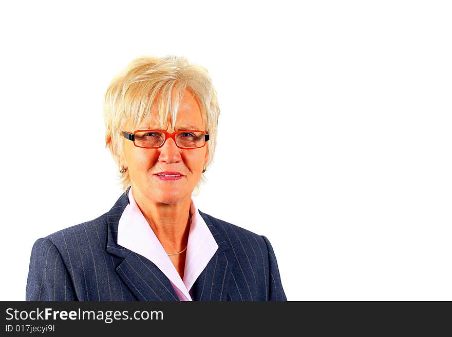 A businesswoman in her sixties with glasses and a suit. Isolated over white. A businesswoman in her sixties with glasses and a suit. Isolated over white.