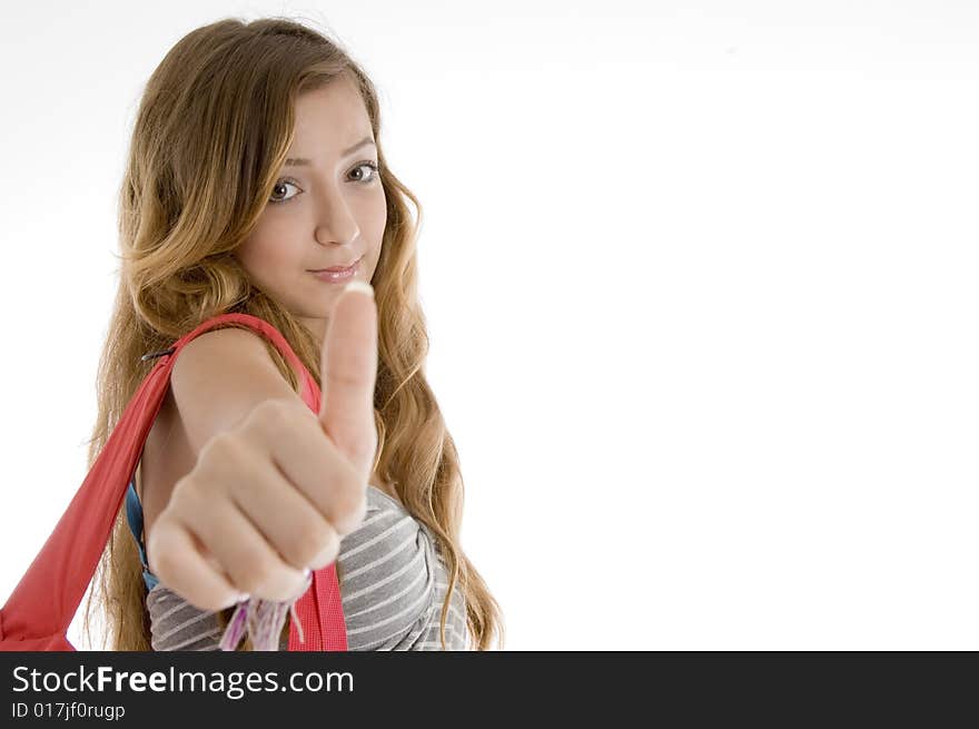 Beautiful girl showing thumbs up hand gesture