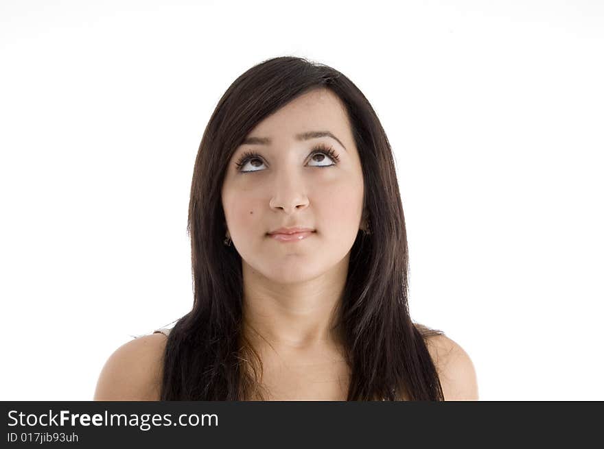 Portrait of pretty brunette female looking upward on  an isolated white background