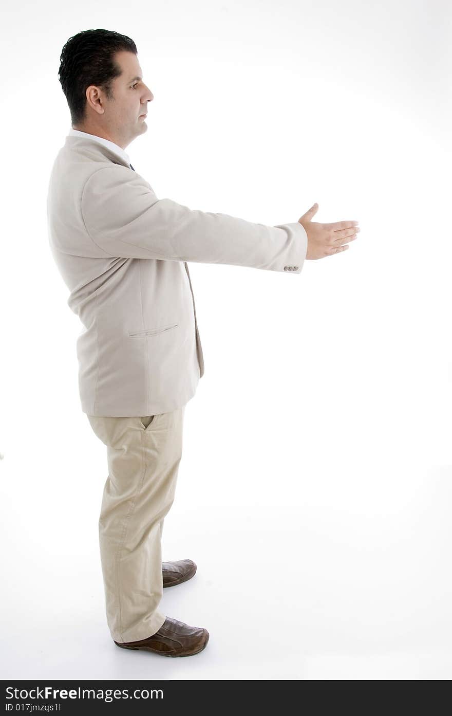 Side view of businessman offering hand shake on an isolated white background