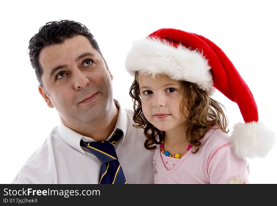 Little girl wearing christmas hat posing with her father