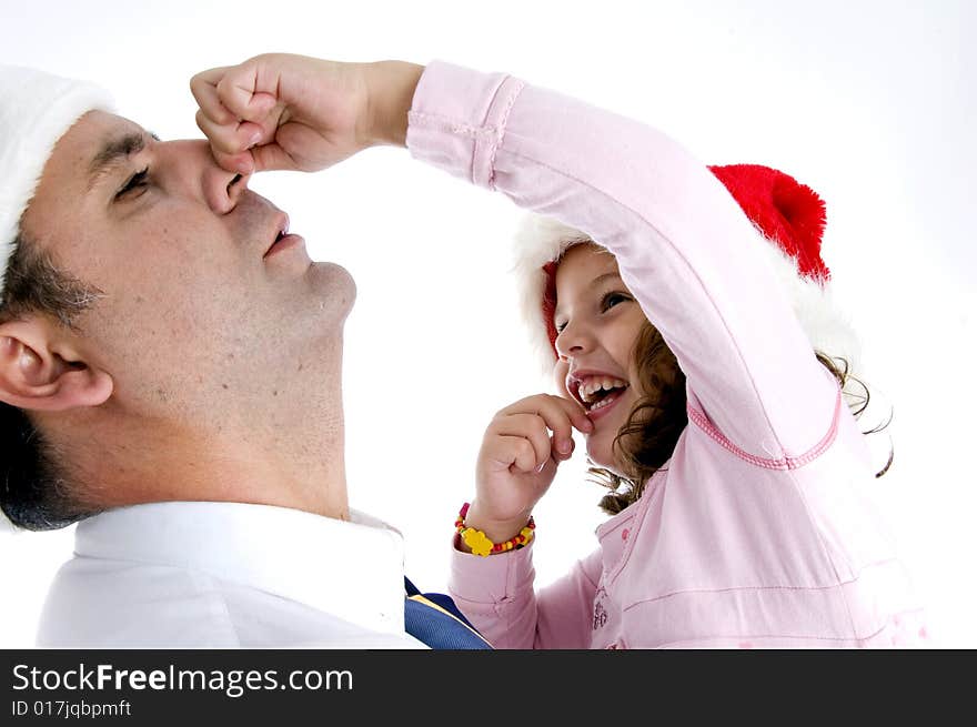 Little girl holding her father's nose