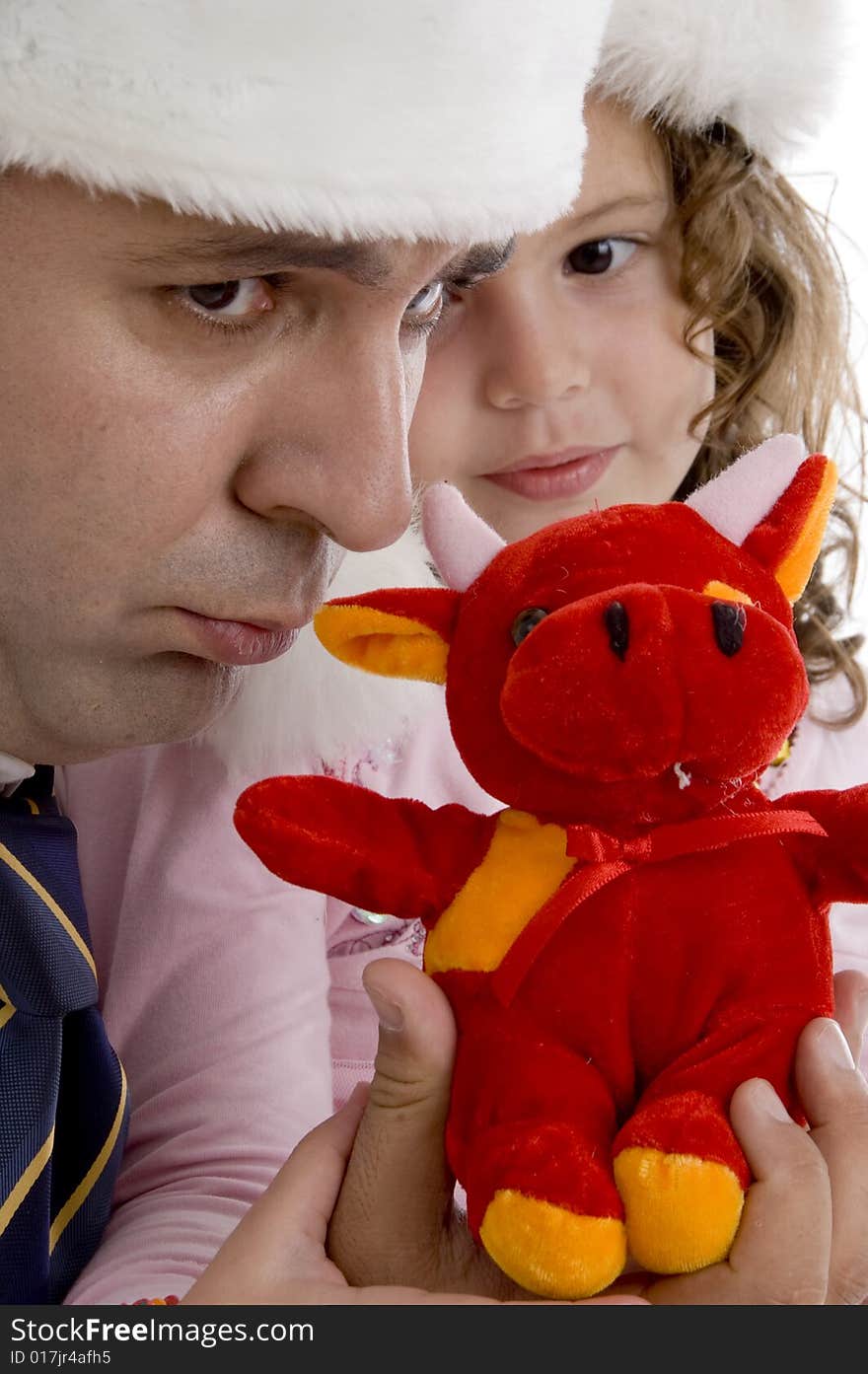 Father posing with his daughter and teddy bear. Father posing with his daughter and teddy bear