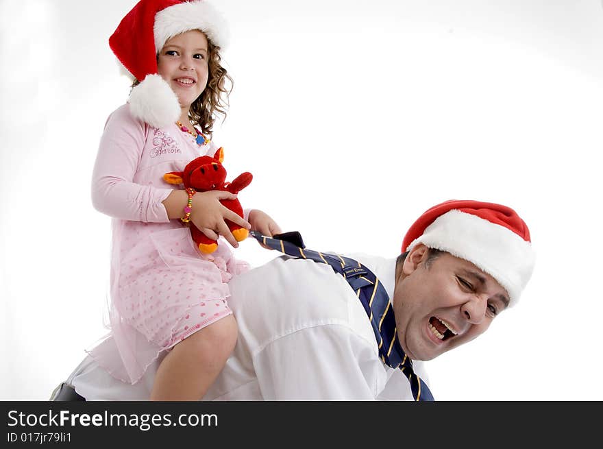 A smiling little girl sitting on her father's back