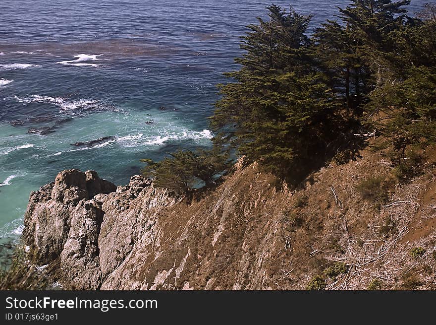 This is a rocky point and cliff on the Pacific Big Sur coast of California. This is a rocky point and cliff on the Pacific Big Sur coast of California.